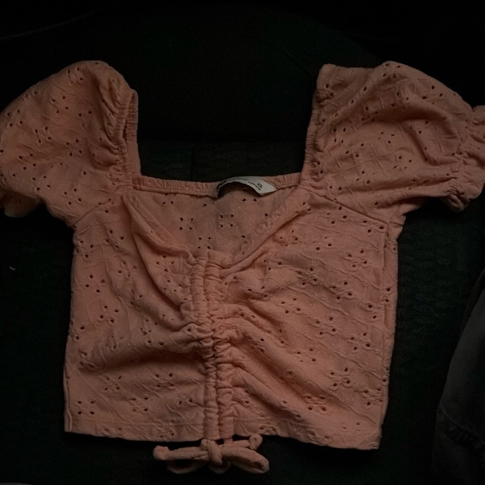 SO peach colored cinched crop top